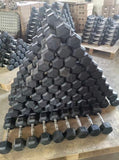 Full view of the rubber hex dumbbells stacked in a pyramid